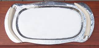 This large antique styled silver plated serving tray is hallmarked by an unknown maker, and presumed to have been made in england in approximately 1920 in an edwardian style. Franco Lapini Silver Plated Serving Tray With Fake Ivory Handles Schlicht Designmobel
