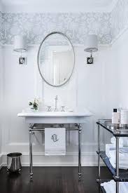 This bathroom from the 1970's shows how interior design allowed for personal style to influence the bathroom. Oval Beaded Mirror Over 2 Leg Washstand Transitional Bathroom