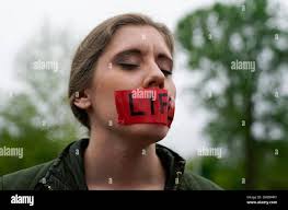 A demonstrator wears tape