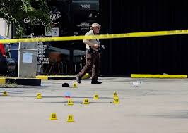 Police tape blocks the scene of the mass shooting near the banquet hall that was rented for the rap concert. Tn7e9ueovg2ozm