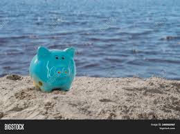 The face of the piggy bank has the requisite sunglasses. Piggy Bank On Sandy Image Photo Free Trial Bigstock