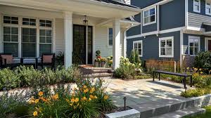Neutral colors paired with black and wood tones is a typical modern farmhouse color palette. Edina Mn Front Yard Landscape Design Southview Design