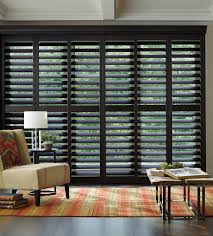 Don't want to block your view but still cover your sliding glass doors? Hunter Douglas Plantation Shutters Heritance Hardwood Shutters