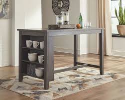 Torjin is the newest innovation in occasional tables. The Caitbrook Dark Gray 5 Pc Rectangular Counter Table 4 Uph Stools Available At 5 Star Furniture Serving Houston Tx And Surrounding Areas
