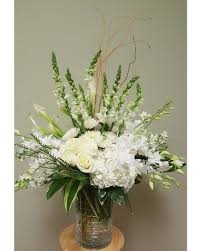 .decorating a tall, clear centerpiece vase is something that you can do with white floral tape and a few other key bio: All White Floral Arrangement In Tampa Fl Buds Blooms Beyond