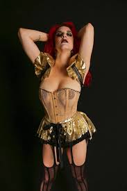 Urban fantasy or sci fi woman in leather with shaved red hair. Redhead Goth Burlesque Burlesquebabes
