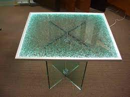 Tempered glass is hardened safety glass manufactured to be more resilient to breaking so you can enjoy a delicate look without the worry of easily shattered glass. Shattered Glass Edge Lit Glass Dining Tables Sans Soucie Glass Dining Table Shattered Glass Reception Desk Glass