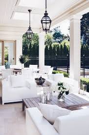Hamptons Style Backyard Pretty Backyard With A Porch Overhang Above White Outdoor Lounge Furniture Couches And Tabl House Design House Exterior Outdoor Spaces