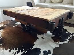 Have a look at this pvc pipe coffee table with a glass top and some wood dowels! Vintage Antique Factory Cart Coffee Table Early 1900s Etsy Antique Wood Floors How To Antique Wood Cart Coffee Table