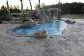 Viking Caribbean Fiberglass Pool With Rico Rock Cave Waterfall Tanning Ledge With Lazy River Spillove Pool Landscaping Backyard Pool Landscaping Backyard Pool