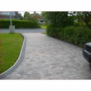 Block paving provides a classic, textured look with structural borders that frame your property beautifully., AI generated