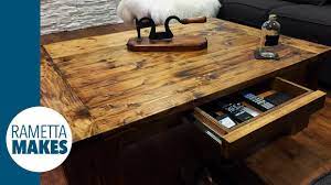Once the shelf panel is squared up and cut down to size, drill 3/4″ pocket holes into each end. How To Build A Coffee Table Diy Youtube