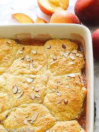 The peaches stew in a sweet rich caramel sauce as it bakes. Easy Peach Cobbler Immaculate Bites