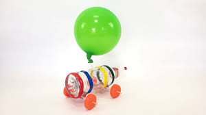 Carefully attach each skewer to one plastic lid to make a wheel and axle. Make A Balloon Car Youtube