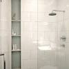 Marble tiling in the tub brings culture into the small space. 1