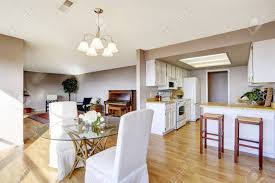 The living room looks more colorful, even though it was still filled with muted colors and earthy tones. Dining Area Connected To Kitchen And Living Room With Hardwood Floor Stock Photo Picture And Royalty Free Image Image 59949835