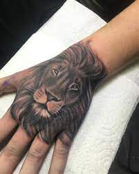 Lion Hand Tattoo Design Tattoideas Hand Tattoos For Guys Lion Hand Tattoo Hand Tattoos