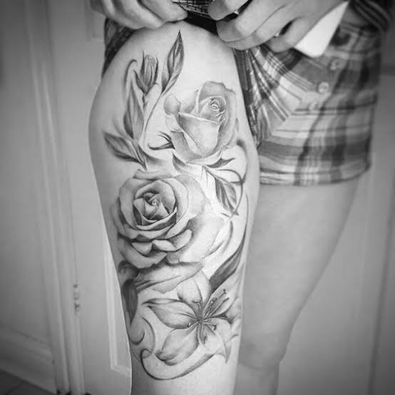 Realistic black and grey work by @mia.j.red. Floral thigh piece, all finished! #blackandgreytattoo #blackandgreyrealism #realistictattoo #realism #floraltattoos #thightattoo #thighpiece #rosetattoos #lilytattoo #silverbackink #femaletattooartist ...