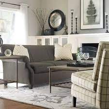 When using a warm taupe for walls or large furnishings such as sofas, add interest with a variety of yellow, pink or pastel patterned pillows, and through similar coloring for small furnishings such as. Graphite Gray Couch With Taupe Y Gray Walls Living Room Grey Home Home Decor