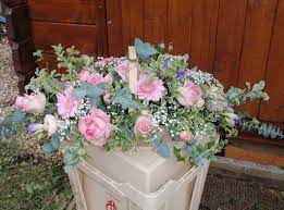 Trug Basket Using Pale Pink Flowers With A Touch Of Lilac Freesias Flowers Feed Funeral Flowers Pink Flowers