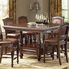 Smaller kitchens or apartment dining rooms are ideal for dinette sets that come with compact tables and two chairs. Antoinette Counter Height Dining Room Set Counter Height Dining Table Set Dining Table Dining Room Sets