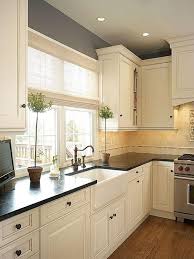 Black cabinet handles and sink faucet can provide contrast against the white farm sink and. 25 Antique White Kitchen Cabinets Ideas That Blow Your Mind Reverb Sf