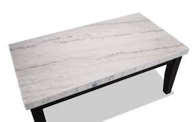 The aro coffee table is a white rhino quartz marble tabletop with marble ringed base and brass details. Montibello White Marble Coffee Table Bob S Discount Furniture
