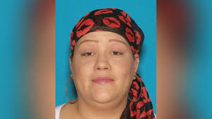 Woman wanted in 'love triangle' stabbing turns self into police