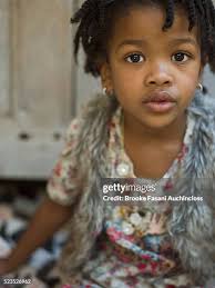 Girl Sitting On Steps Eating Snacks Portrait High-Res Stock Photo