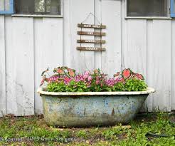 Rose petals put in bathtub for romantic bathroom in honeymoon suit. I Filled An Old Bath Tub That Was Sitting Beside The Garden House With Summer Flowers This Is In June Garden Bathtub Garden Spaces Garden Tub