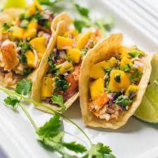 Remove skin from fish and divide fish among tortillas. Fish Tacos With Mango Salsa Greenstar