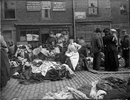 A Secondhand Clothes Seller At Newcastle Cloth Market Reads As Customers Inspect Her Goods A Set Of Original Glass Ne Victorian Street Newcastle Street Scenes