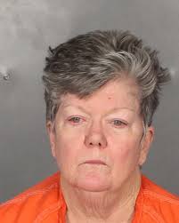 Woman charged with kicking, biting elderly husband