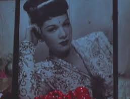 Beverly Grant as "Cobra Woman" in Normal Love (Jack Smith, 1963), with a  portrait of Maria Montez (10 screen captures)