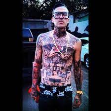 'elephant head' tattoo on his left leg. Pin On Yelawolf