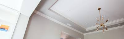Coffered ceilings are generally easy to build, as you simply introduce an exposed beam or protruding feature in a rectilinear pattern to create the vaulted feel. Coffered Ceilings
