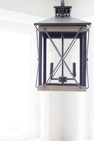 I love framed mirrors in the bathroom but i really don't like the idea of ripping out a large builder mirror to replace it with a smaller framed one. Tips For Replacing Light Fixtures Everyday Edits