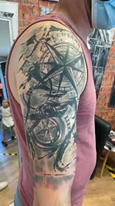 A traditionally styled and colored anchor is placed behind the wearer's ear. Milaink Tattoo Home Facebook