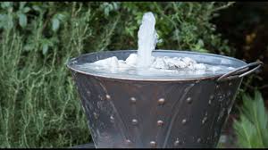 We learned how to drill holes into glass bottles and constructed a somewhat touchy system of hanging the bottles, which we. Make A Whiskey Barrel Water Feature Youtube