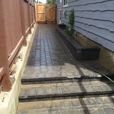 Paving stones can withstand more than 8,000 psi, whereas concrete endures 2,000 psi. Paving Stones Steps Add Beauty And Improve Grade Changes Shacoma Stone Deck Stone Deck Stone Step Paving Stones