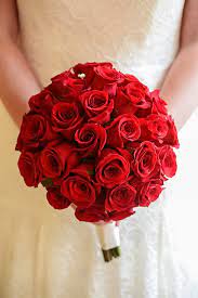 Brides having beach weddings tend to pick bolder colors for their beach wedding bouquets. Simple Yet Stunning Red Rose Wedding Bouquet At Walt Disney World Red Bouquet Wedding Red Rose Bouquet Rose Wedding Bouquet