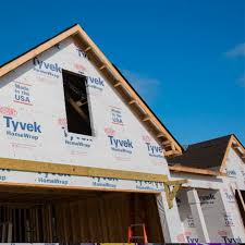 Tyvek needs to overlap the bottom piece as it goes on up the wall. Dupont Tyvek Building Products Inc