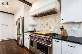 The combination of a light solid color with a dark stain on the island creates a visual masterpiece. Malibu White Shaker Cabinets Top Quality Kitchen Cabinets
