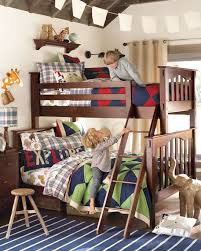 In this example, a boy full of energy has a charming room complete with a wall climbing panel. Shared Boy Bedroom Ideas Design Corral