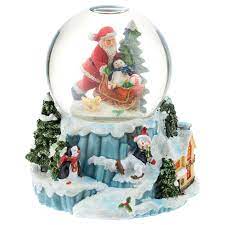 Detail on the back of the sleigh shows a cozy winter landscape with cottage. Snow Globe With Santa Claus And Sleigh H 15 Cm Online Sales On Holyart Com
