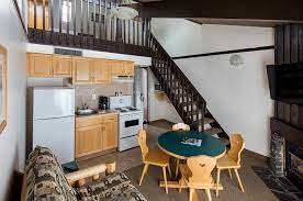An office space fixed under a skylight is also found in the loft. Loft Apartment At The Rocky Mountain Ski Lodge In Canmore