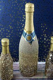Christmas trees and santa hats: How To Decorate Champagne Bottles For Christmas And Holiday Parties Glitter Champagne Bottles Glitter Champagne Glitter Wine Bottles