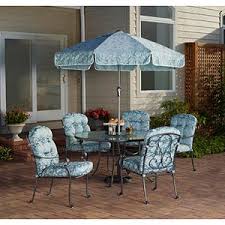 It includes a dining table, four sling folding chairs and a market umbrella. 398 At Walmart 6 Piece Set With Middle Glass Lazy Suzan Patio Patio Furniture Dining Set Outdoor Patio Set