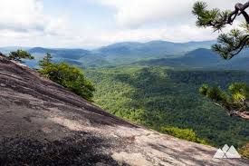 Its' towering omnipresence fills the forest with iconic views, classic climbing a spur trail leads from the back of the helicopter landing zone to the lower looking glass cliffs. Looking Glass Rock Trail Asheville Trails