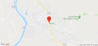 Sandwiched between barbed wire and a meadow with a sign that reads don't get shot! Forget Me Knot Flowers Gifts Moab Ut Florist 84532 Zip